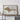 a large framed map of the United States, specifically the state of Michigan, displayed on a wooden shelf.