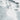 The image is a satellite view of a large body of water, likely an ocean or a large lake, with a white, wavy surface. The water appears to be covered in snow or ice, creating a contrast between the white and gray colors. The image does not contain any text or specific details about the location or surrounding area.