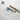 a roll of paper with a watercolor painting of a landscape on it, along with a cardboard tube and a text overlay promoting fine art prints made in the USA.