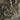 The image is a satellite view of a mountainous region, showing the rugged terrain and winding paths of the landscape.