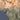 The image is a satellite view of a mountainous region, showing various geographical features such as hills, valleys, and bodies of water.