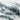 The image is a 3D rendering of a mountainous terrain, with a predominantly white and gray color palette. The terrain appears to be rocky and rugged, with varying shades of gray and white. The image does not contain any text or other discernible objects or actions.