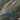 The image is a satellite view of a large body of water surrounded by rugged, mountainous terrain.