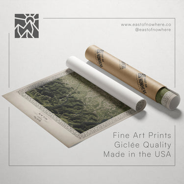 a roll of paper with a printed image of a landscape, along with a tube of paper and a website address for fine art prints.