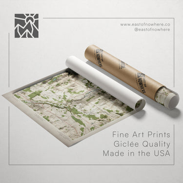 a map printed on paper and a roll of paper with a map printed on it, both placed on a white background.