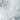 The image is a close-up of a textured surface, possibly a wall or a piece of fabric, with a white, wavy pattern. The surface appears to be made of a material that resembles a mix of white and gray, with some darker areas interspersed throughout. The image does not contain any discernible text or countable objects, and there are no specific actions or movements depicted.
