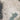 The image is a satellite view of a large body of water, likely a lake or ocean, surrounded by mountains and densely populated urban areas.