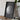 a framed photograph of the moon, placed on a wooden surface next to a camera and some books.