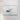 The image is a framed artwork depicting a small, abstract shape resembling a wave or a cloud, hanging on a white wall.