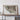 a large framed map of the United States, with a wooden shelf below it.