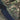 The image is a satellite view of a rural area with agricultural fields, roads, and a large body of water, such as a lake or river, running through the landscape.