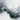 The image is a close-up of a rocky, mountainous terrain with a predominantly white and gray color palette.