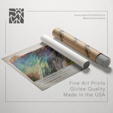 a roll of paper with a colorful abstract painting on it, along with a tube of paper and a website address for fine art prints.