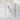 The image is a framed artwork depicting a piece of paper with a watermark or text on it, hanging on a white wall.