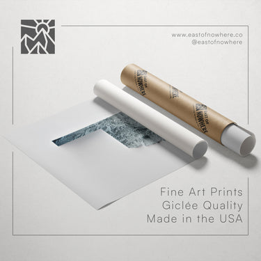 a roll of paper with a printed image of a mountain range, along with text promoting fine art prints made in the USA.