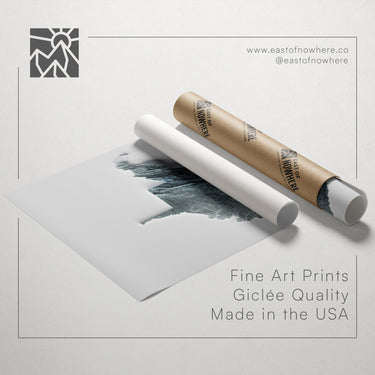 a roll of paper with a drawing of a cityscape on it, along with text promoting fine art prints made in the USA.