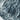The image is a close-up of a rocky, mountainous terrain with a textured, rocky surface.