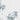 The image is a close-up of a white surface with a small, gray object in the top right corner.