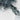 The image is a close-up of a rocky, mountainous terrain with a predominantly gray and white color palette.
