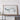 a large framed artwork depicting a stylized, abstract landscape or mountain range.