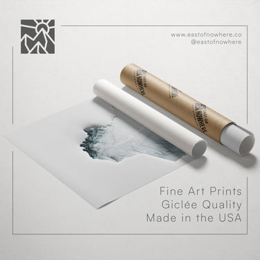 a roll of paper with a printed image of a mountain landscape, along with text promoting fine art prints and their quality.