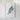 a white framed artwork depicting a light blue, abstract shape resembling a mountain or hill.