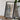 A framed map of Lake Tahoe is displayed on a wooden table, accompanied by a camera, a book, and a plant.