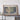 a large framed map of the United States, with a wooden shelf below it.