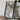 a framed map of India, with a camera and some books placed on a wooden table in front of it.