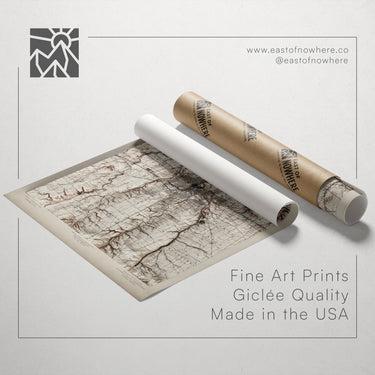 a map printed on paper and a roll of paper with a map printed on it, both placed on a white background.