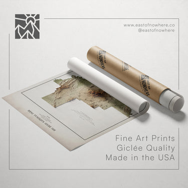 a map of the Grand Canyon, along with a roll of paper and a tube of paper, all placed on a white background.