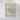 The image is a framed map of a city, depicting various streets, landmarks, and geographical features.