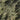 The image is a satellite view of a mountainous region, showing a rugged, rocky landscape with various peaks and valleys.