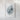 The image is a framed artwork depicting a textured, abstract shape resembling a mountain or hill.