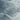 The image is a close-up view of a snow-covered landscape, showcasing the intricate patterns and textures of the snow.