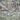 The image is a satellite view of a densely populated urban area, showing a complex network of roads, buildings, and other infrastructure.