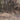 The image is a satellite view of a mountainous region, showcasing the rugged terrain and the winding paths carved into the landscape.