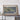 a large framed map of the Dominican Republic, with a wooden shelf below it.