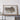 a large framed map of Schynthwa County, North Carolina, displayed on a wooden shelf.