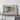 a large framed geological map of Pennsylvania, with a wooden shelf below it.
