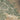 The image is a satellite view of a large city, showing a densely populated urban area with roads, buildings, and other infrastructure.