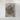 The image is a framed photograph of a rocky, mountainous landscape.