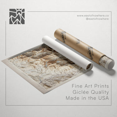 a map printed on paper and a roll of paper with a map printed on it, both placed on a white background.