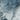 The image is a close-up of a rocky, mountainous terrain with a textured, rocky surface.