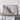 a large framed map of Mexico, with a wooden shelf below it holding a camera and a suitcase.