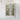 The image is a framed map of a mountainous region, with a detailed and intricate depiction of the landscape.