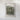 The image is a framed artwork depicting a landscape with a rocky, mountainous terrain.