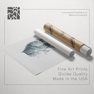 a roll of paper with a drawing of a landscape on it, along with a tube of paper and a text overlay promoting fine art prints made in the USA.