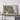 a large framed map of a mountainous region, with a wooden shelf below it.