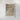 The image is a framed print of a detailed, textured map or geological feature, possibly a representation of a mountain range or a geological formation.